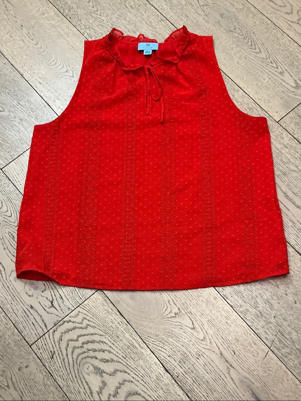 Woman’s CeCe red eyelet sleeveless top with tie. Large. Lined. Ruffled neck.